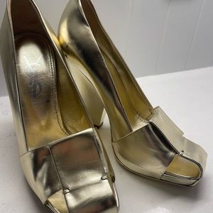 Yves Saint Laurent gold pumps